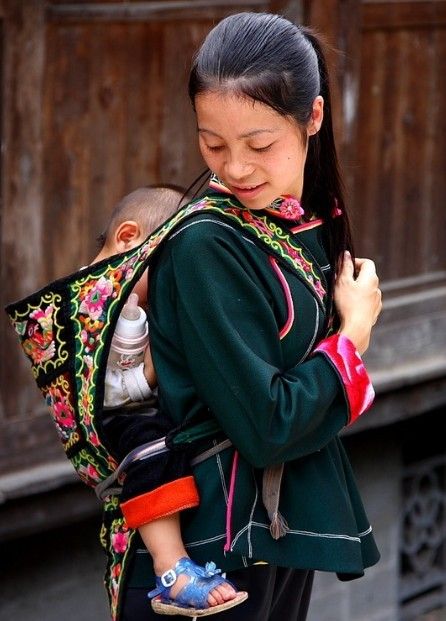 Moms And Babies From Around The World Benefit In Nursing Slings