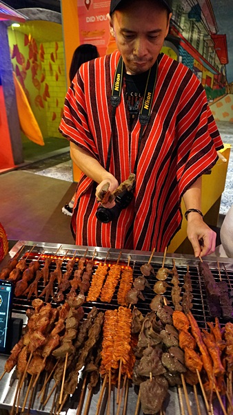 Pose as barbecue and isaw seller!