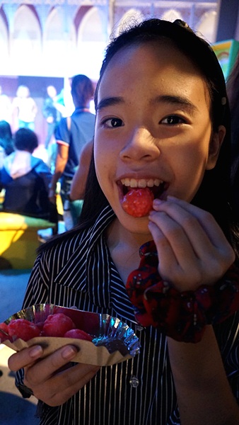 busy eating kwek kwek while the rest of us watch the cultural performances in the background 