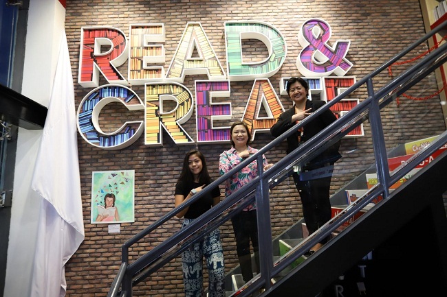 Artist Raya Simpao, National Bookstore managing director Alexandra Ramos - Padilla, and KidZania Manila sales director Cecille Marino