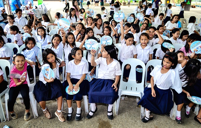 Students of Labangon Bliss Elementary School are all smiles and excited as they wait for their turn during the shampooing activity.