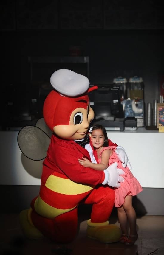 Jollibee gives Scarlet a hug to celebrate their first TV together.