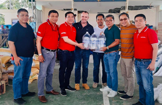 President and CEO Gareth McGeown with CCBPI’s local Davao team led the delivery of Wilkins™ water to hardest-hit areas in Mindanao.